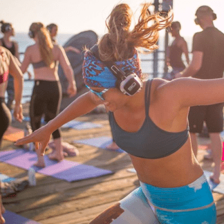 Rooftop yoga with silent disco headphones