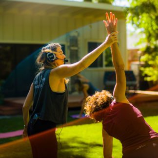 Yoga class with silent disco technology