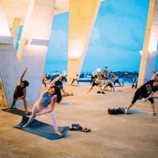 Socially distanced yogis practice outdoors