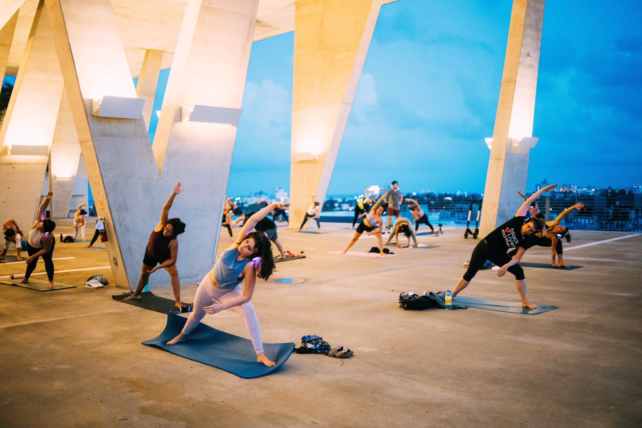 Socially distanced yogis practice outdoors