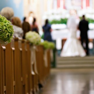 Aisle view of bride and groom at wedding ceremony