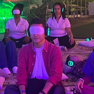 Participants enjoying a sound bath with silent disco headphones at the Ikea Art Basel pop-up