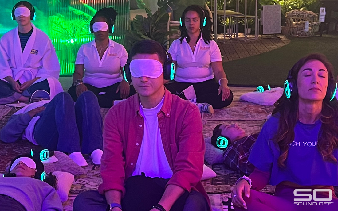 Participants enjoying a sound bath with silent disco headphones at the Ikea Art Basel pop-up